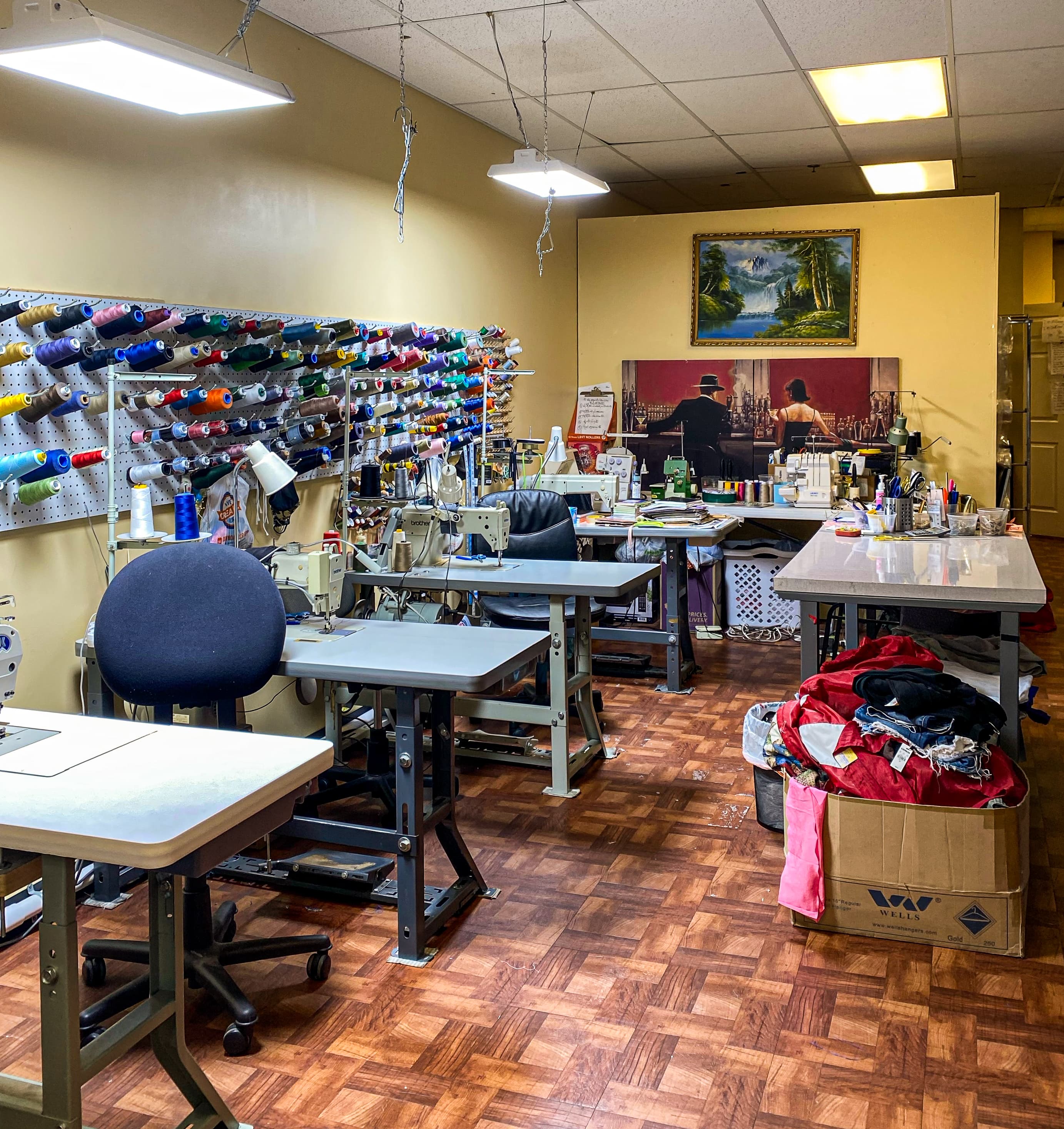 Tailoring workshop with sewing machines and thread wall at Vila Cleaners in Smyrna TN